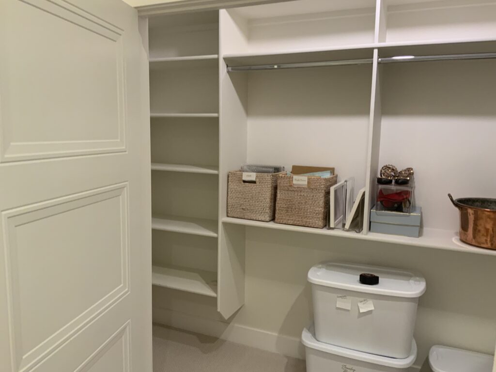 Before photo of unused storage closet before JKE Home Reset custom wrapping closet design.