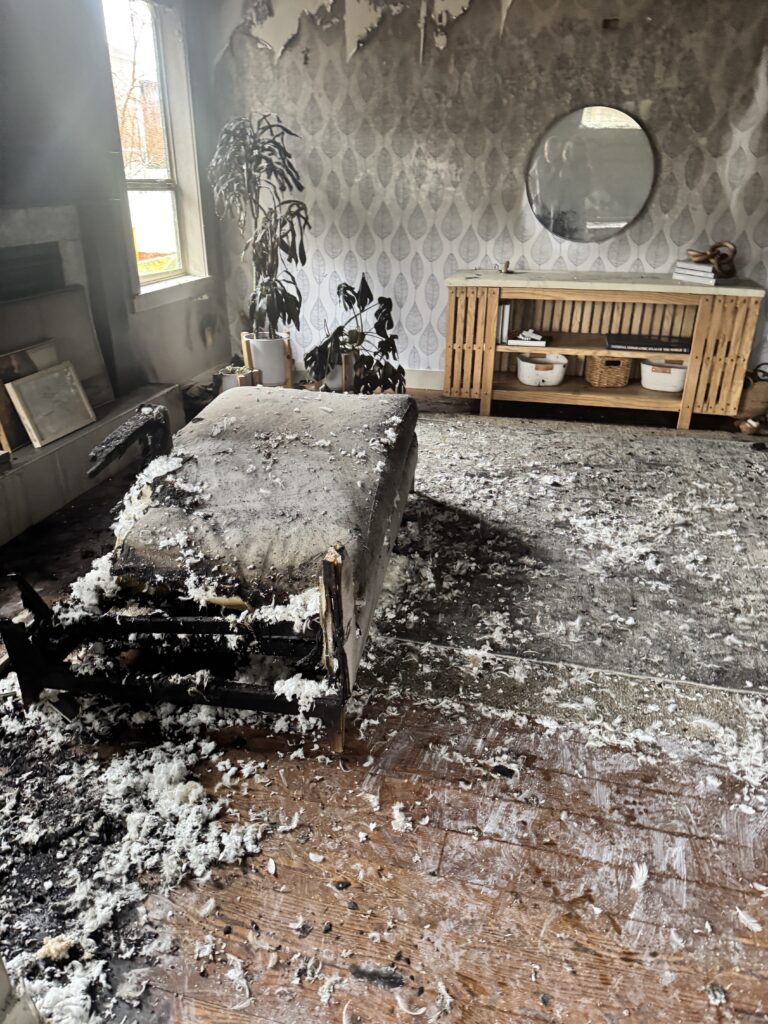 Fire damage of furniture being burnt and wallpaper burnt