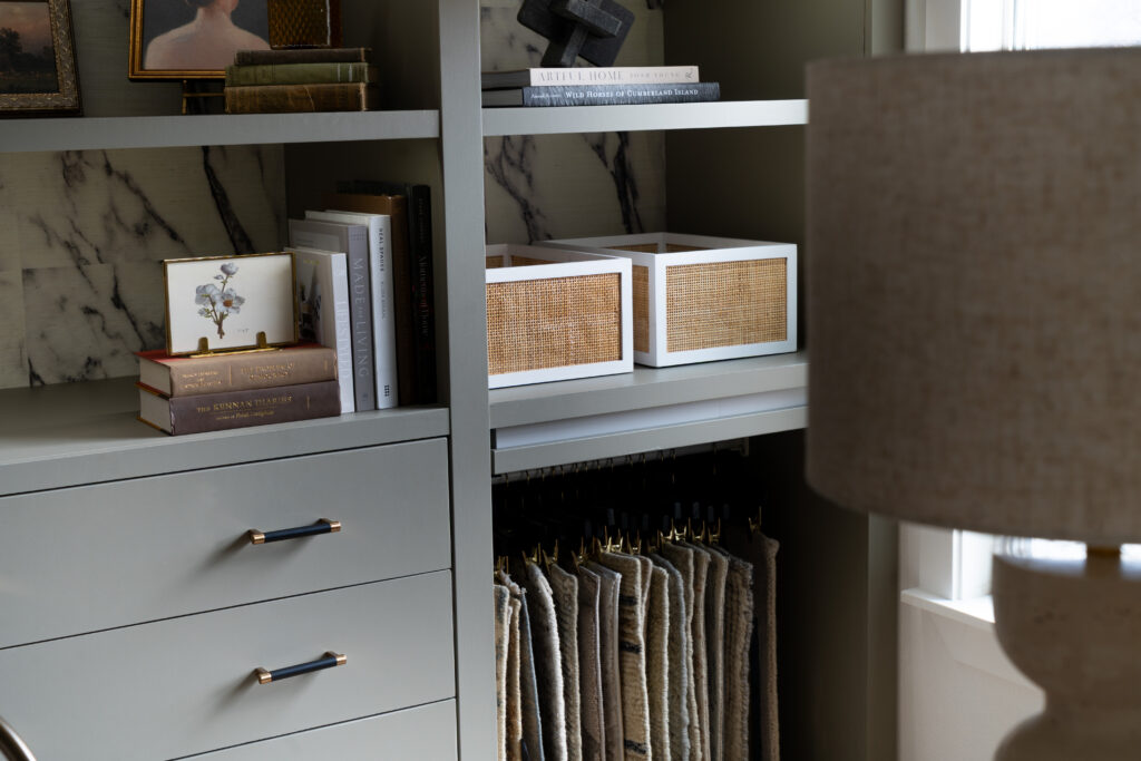 Custom built in shelves with marble accents and curated decor for JKE Home studio.
