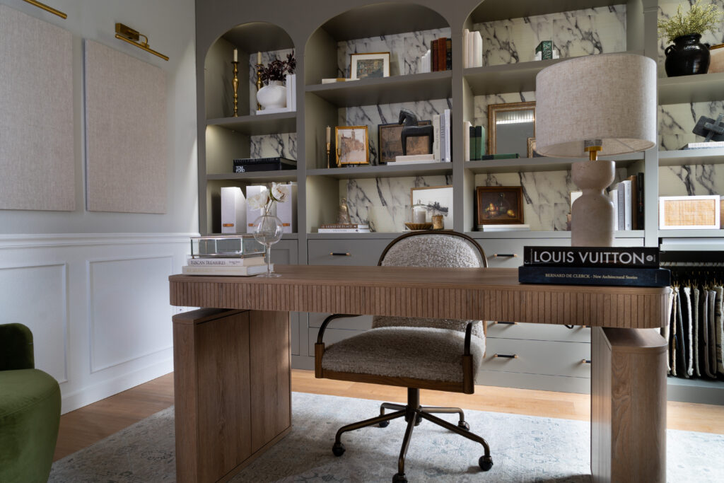 Custom interior design office with arched built-in shelves, marble detail, Louis Vuitton book decor, and high-end workspace by JKE Home Reset.